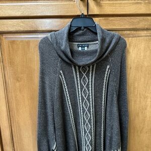 Brown and tan cow neck sweater. It is like a poncho with sleeves.